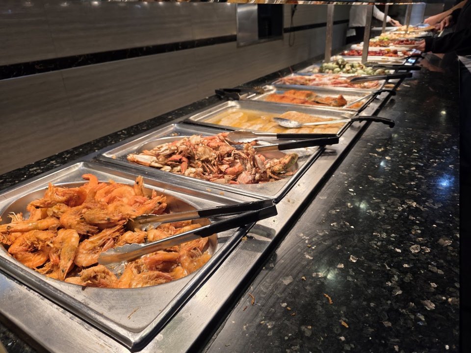 Counter service area beside a long buffet spread.