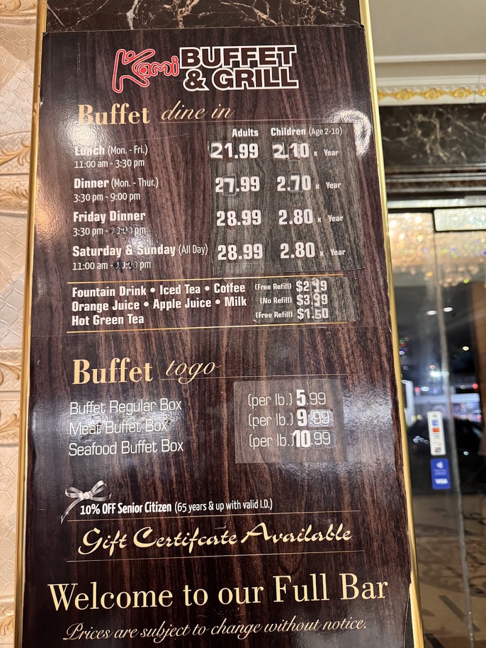 Menu board listing buffet times and drink choices.